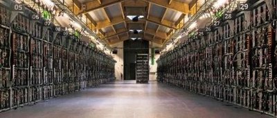A modern mining farm with rows of mining rigs and advanced cooling systems, representing the shift towards energy-efficient hosting.